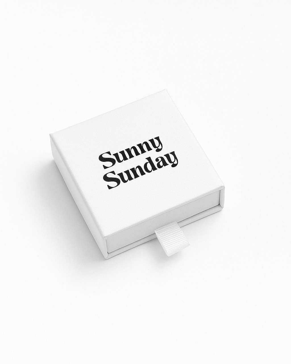 White box with 'Sunny Sunday' text on a white background